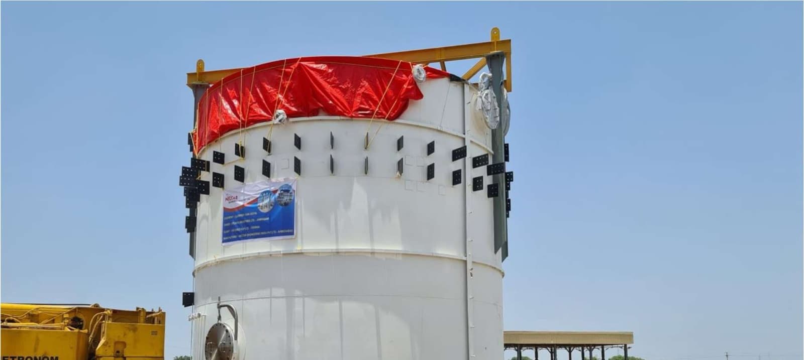 The stainless-steel clarifier tank fabricated for the EKCP Chennai project, carrying the Nectar Engineering project banner