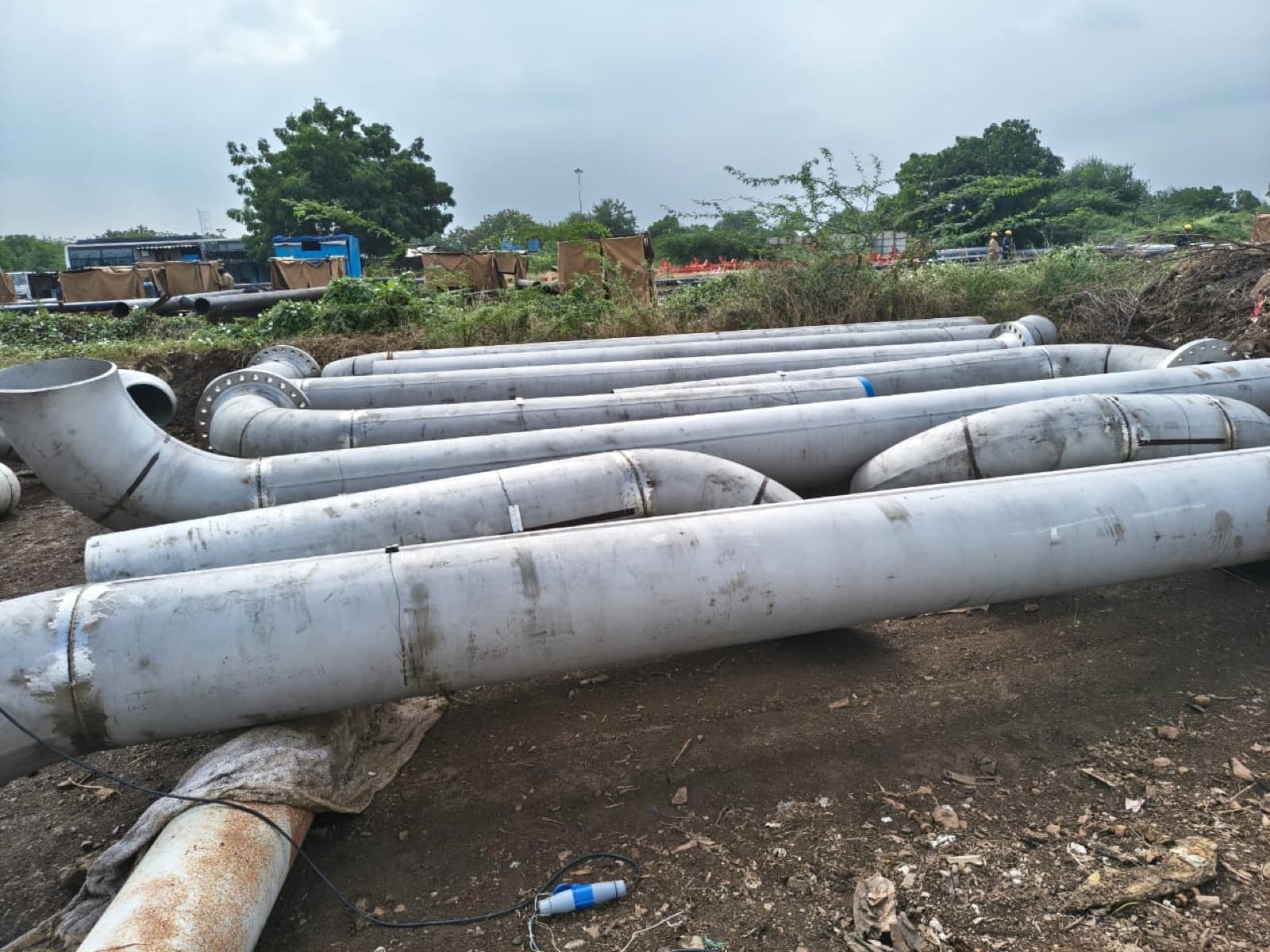 Completed stainless-steel pipe spools staged in the fabrication yard
