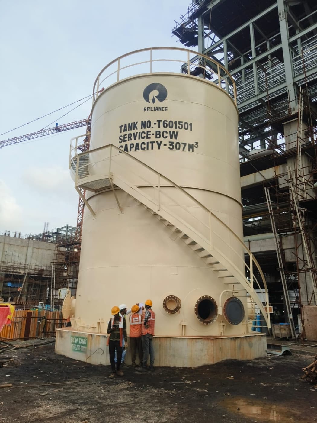 Completed BCW storage tank (Tank T601501) for the Reliance polysilicon project, with the Nectar Engineering site crew at its base