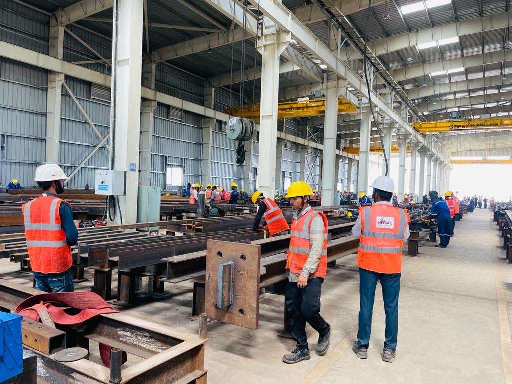 The Nectar Engineering fabrication shop, with the crew preparing steel members beneath overhead travelling cranes